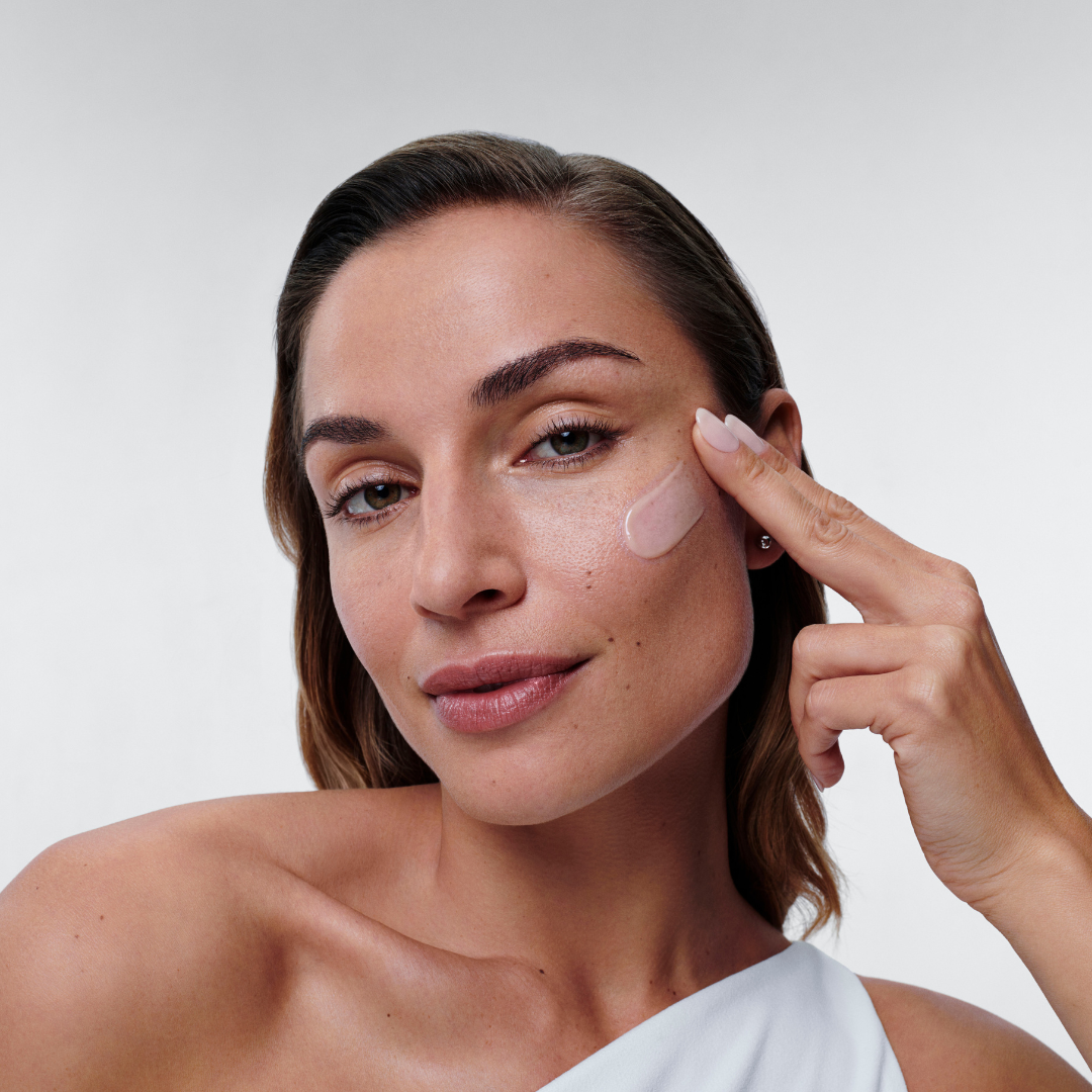 Alastin Restorative Skin Complex with TriHex 1oz applied on model cheek