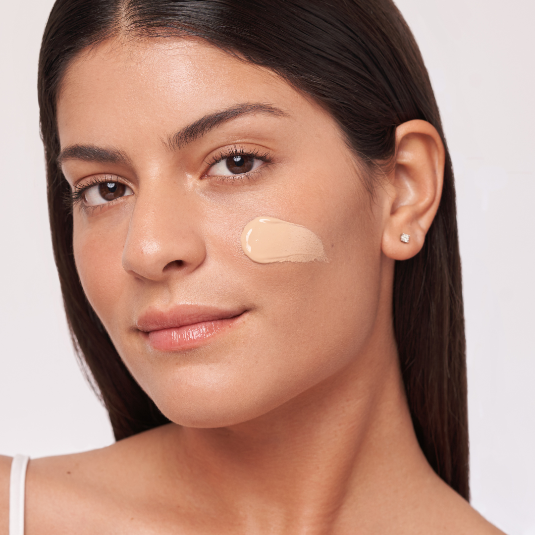 Alastin HydraTint Pro Mineral Sunscreen SPF 36 applied on model cheek